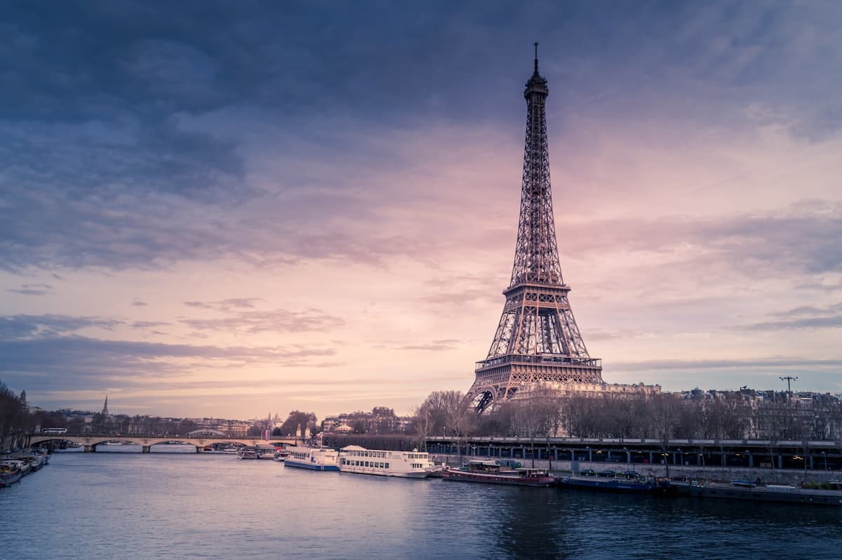 The Eiffel Tower across the Seine at dusk