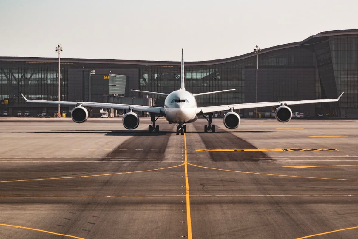 An airliner parked on the apron in front of a terminal