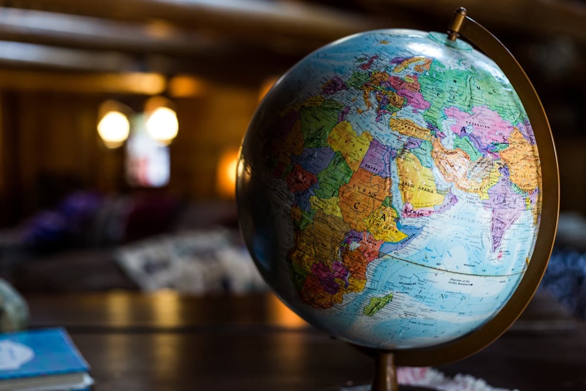 A world globe on a desk in warm light